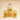 Two clear glass pump bottles standing beside the amber refill bottle