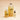 Amber refill bottle, clear pump bottle and small clear to-go bottle together